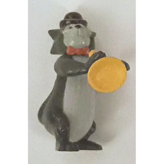 1995 McDonalds Happy Meal toy: Scat Cat Aristocats penguin in top hat, bow tie, holding yellow frisbees