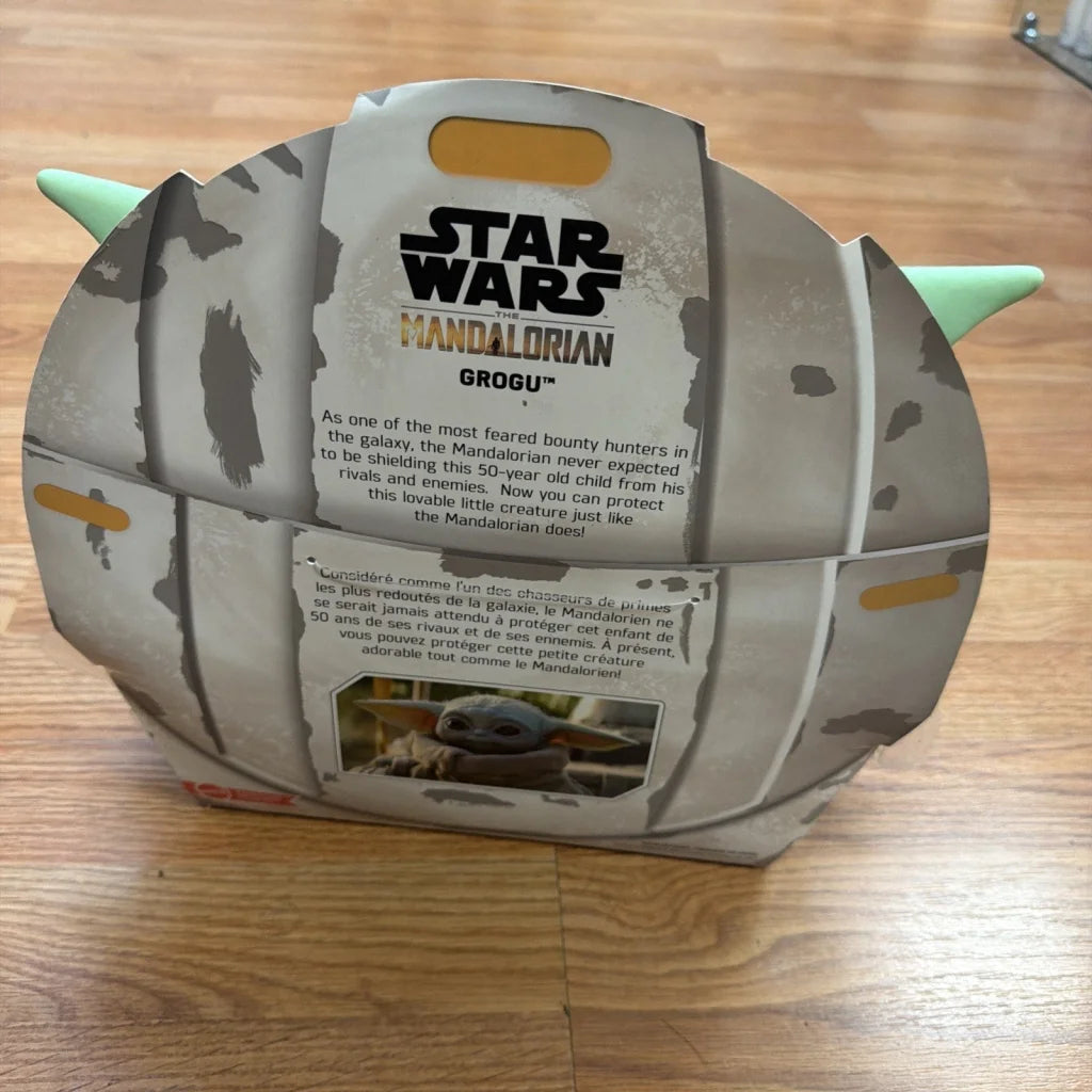 Disney Star Wars Mandalorian Grogu helmet toy packaging, weathered gray green design