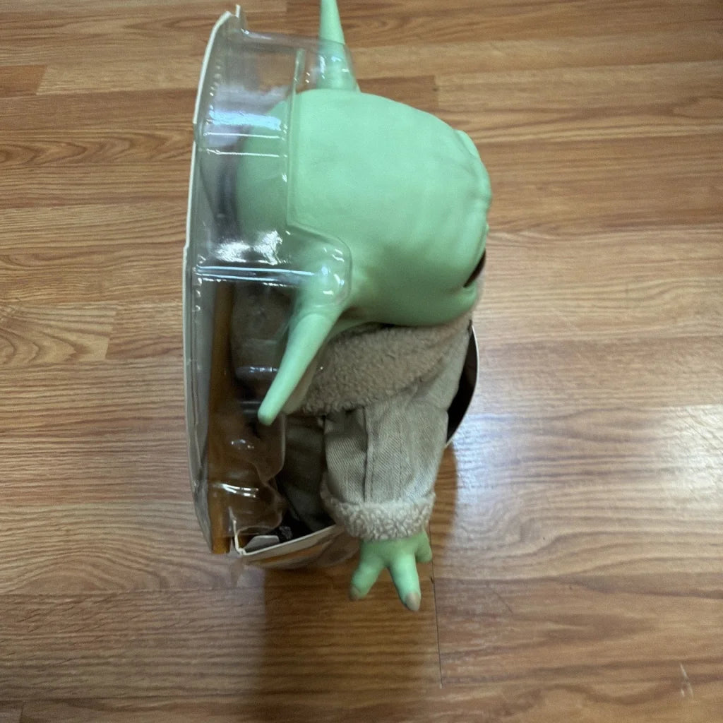 Disney Star Wars Yoda The Child 11-inch action figure in mint green with jacket