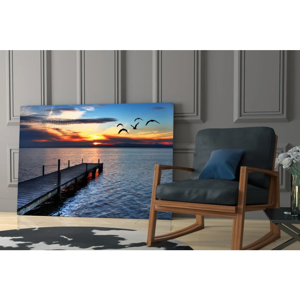 Serene sunset glass wall art with flying birds over water