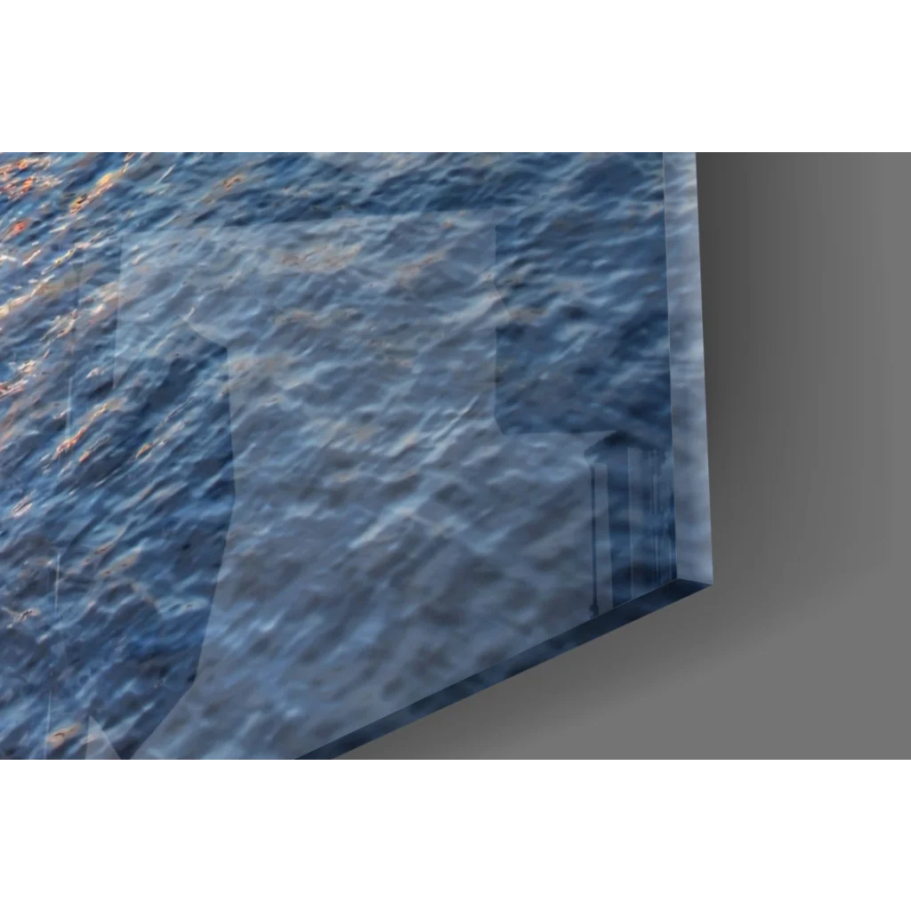 Blue rippling water glass wall art with sunset pier and flying birds