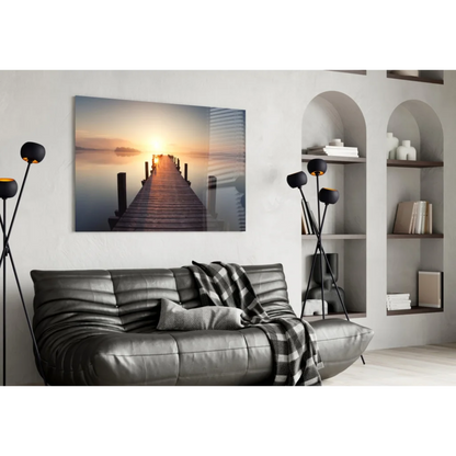 Sleek dark gray leather sofa in modern Stunning Sunrise Pier glass wall art print
