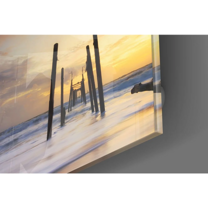 Stunning tempered glass art of ocean sunset with pier pilings
