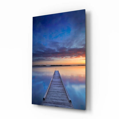 Serene pier glass wall art with sunset hues on calm water