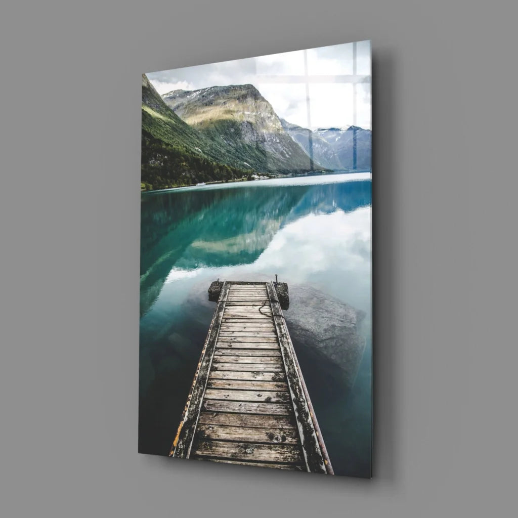 Tranquil dock glass wall art with serene lake and misty mountains