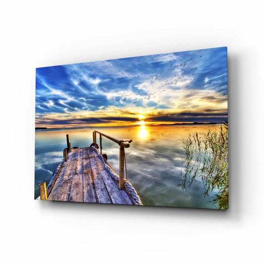 Sunset dock wall art with vibrant golden reflections on calm water