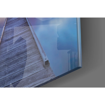 Sleek transparent glass wall art panel with metallic frame, sunset pier design