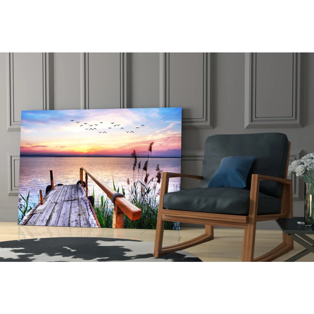 Serene sunset glass wall art with dock, reeds and birds