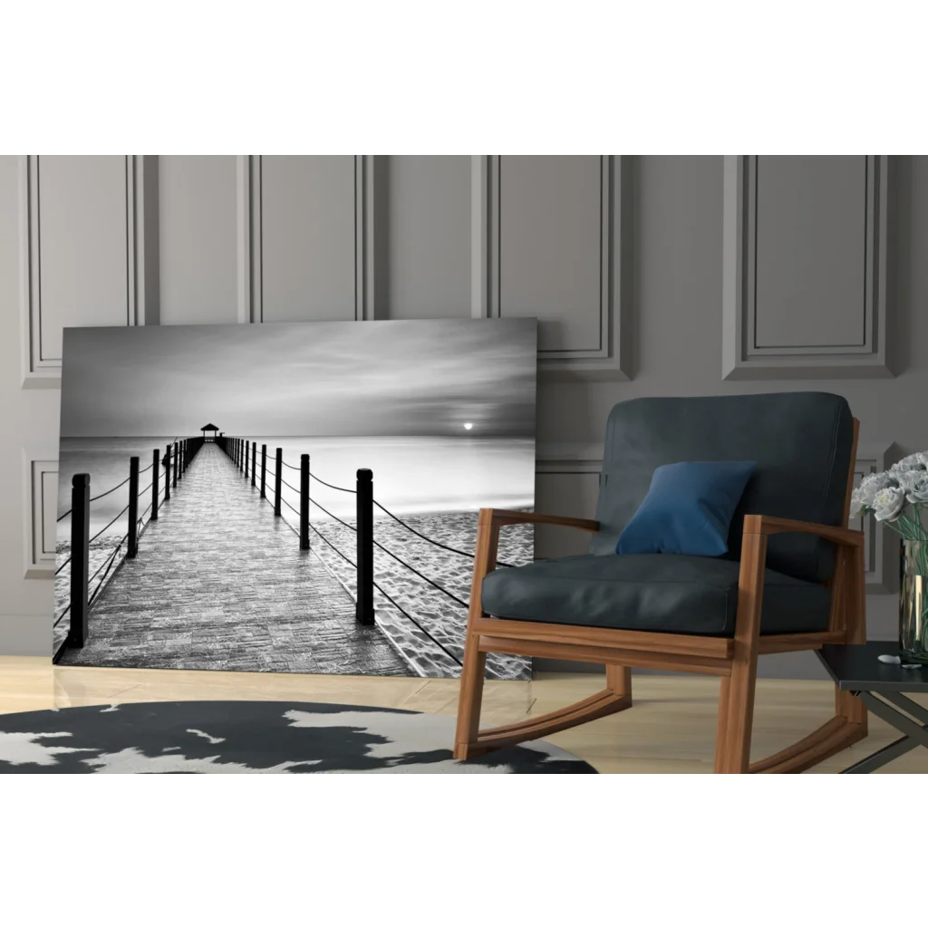 Black-and-white glass wall art of pier with lighthouse