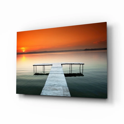 Orange sunset over calm water with wooden pier wall art print