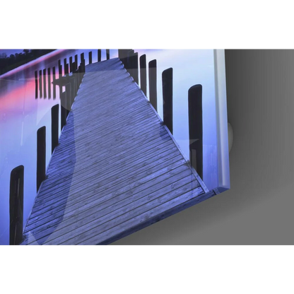 Stunning twilight pier glass wall art of wooden dock with dark gray planks and black railings under cool blue light