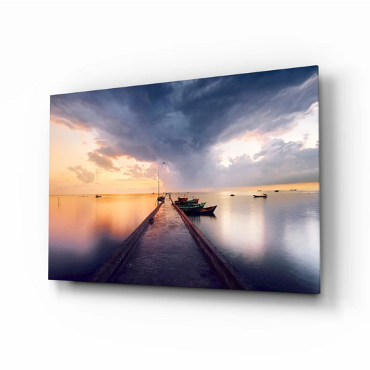 Vibrant sunset marina glass wall art with orange purple skies and boats