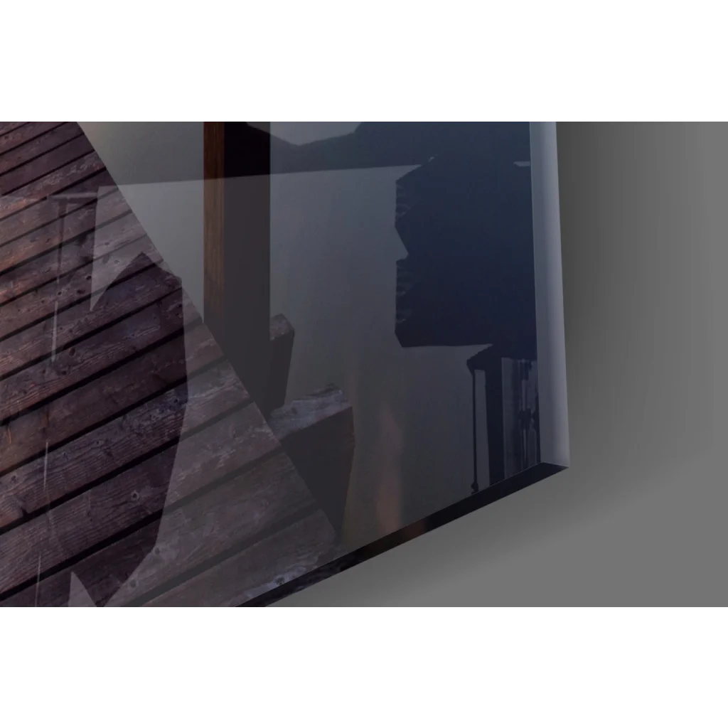 Sleek black-framed glass wall art print of sunrise pier with wooden planks and dark silhouettes