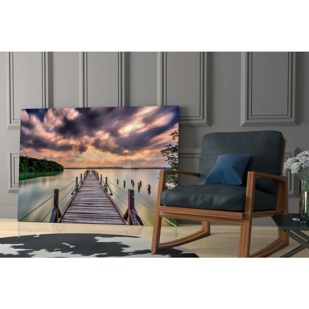 Stunning glass wall art of wooden pier over calm water with dramatic sky