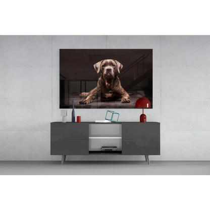 Framed brown dog glass wall art print in dimly lit interior