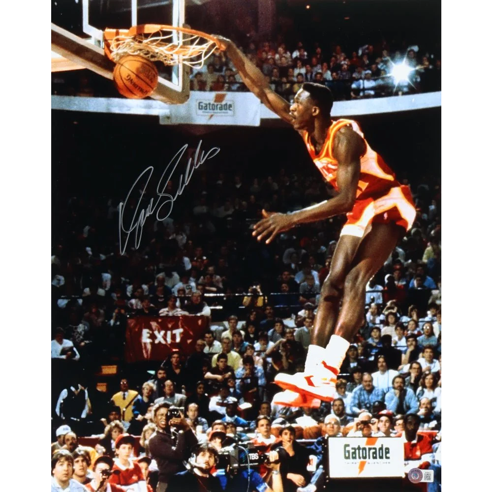Autographed Dominique Wilkins signed Hawks photo of dunking basketball for your collection