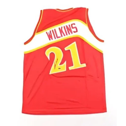 Signed Dominique Wilkins jersey with Schwartz Sports hologram and autographed Hawks gear