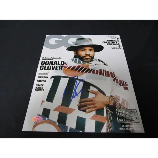 Donald Glover signed GQ magazine page with authentication sticker for fans and collectors
