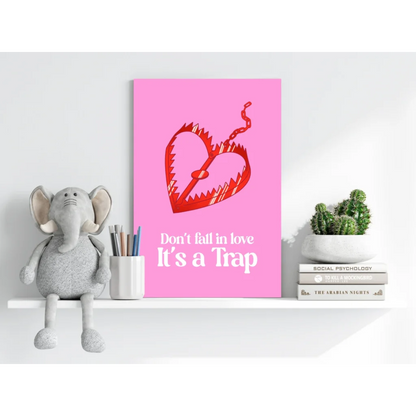 Pink heart poster with red dragon and Don’t Fall in Love It’s a Trap text on shelf
