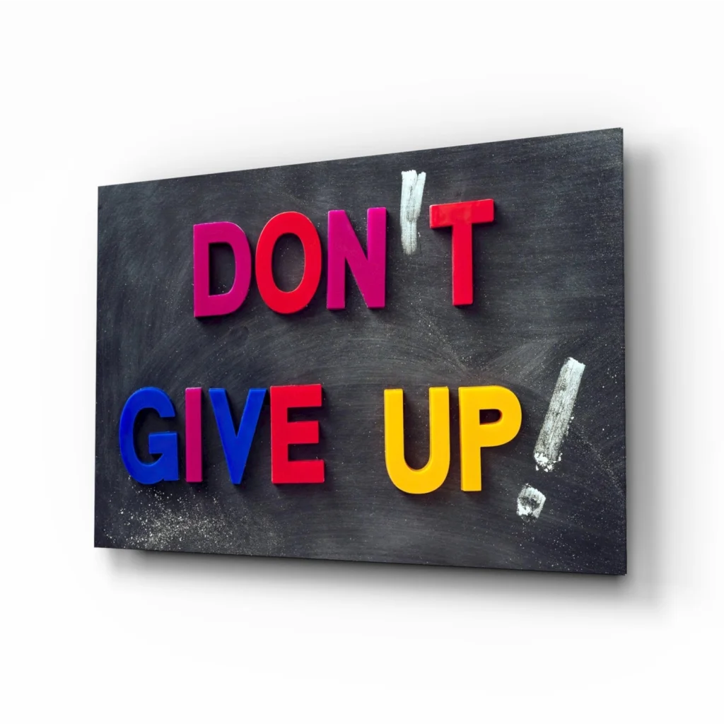 Vibrant 3D Don’t Give Up glass wall art sign on blackboard