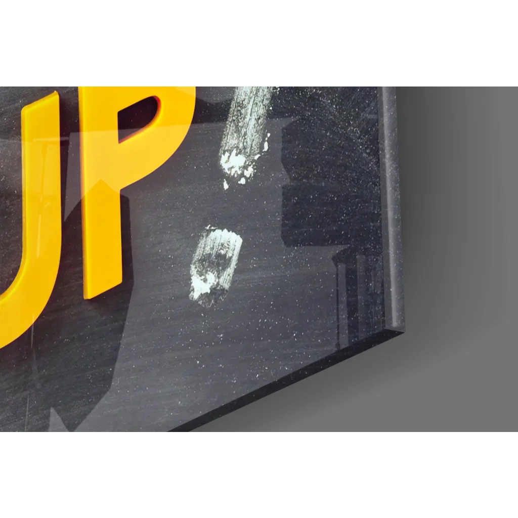 Glossy black 3D glass wall art sign with bold yellow Don’t Give Up lettering