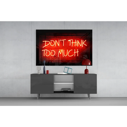 Glowing red neon glass wall art sign reading dont think too much