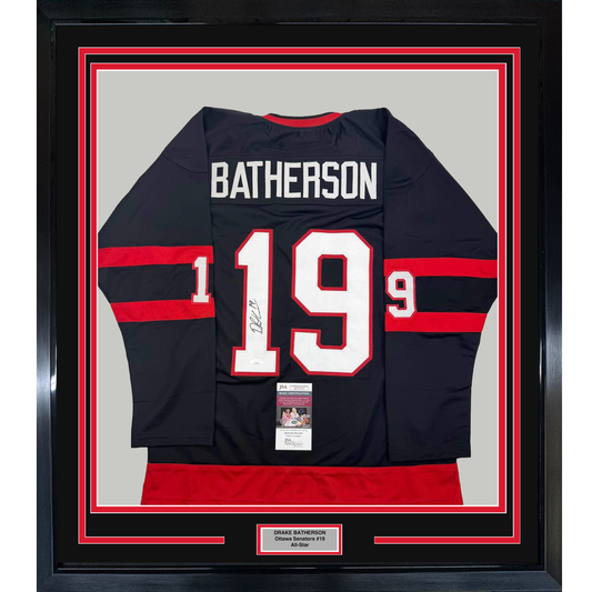 Framed front view of black and red striped Ottawa Senators hockey jersey #19 Batherson with white lettering and JSA authentication certificate.