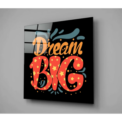 Dream big glass wall art panel with orange red lettering and yellow stars