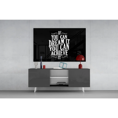 Black framed glass wall art with motivational quote if you can dream it you can achieve it in white serif font