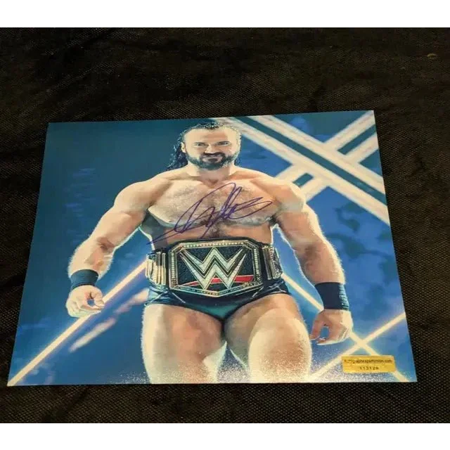 Autographed 8x10 photo of Drew McIntyre with championship belt display