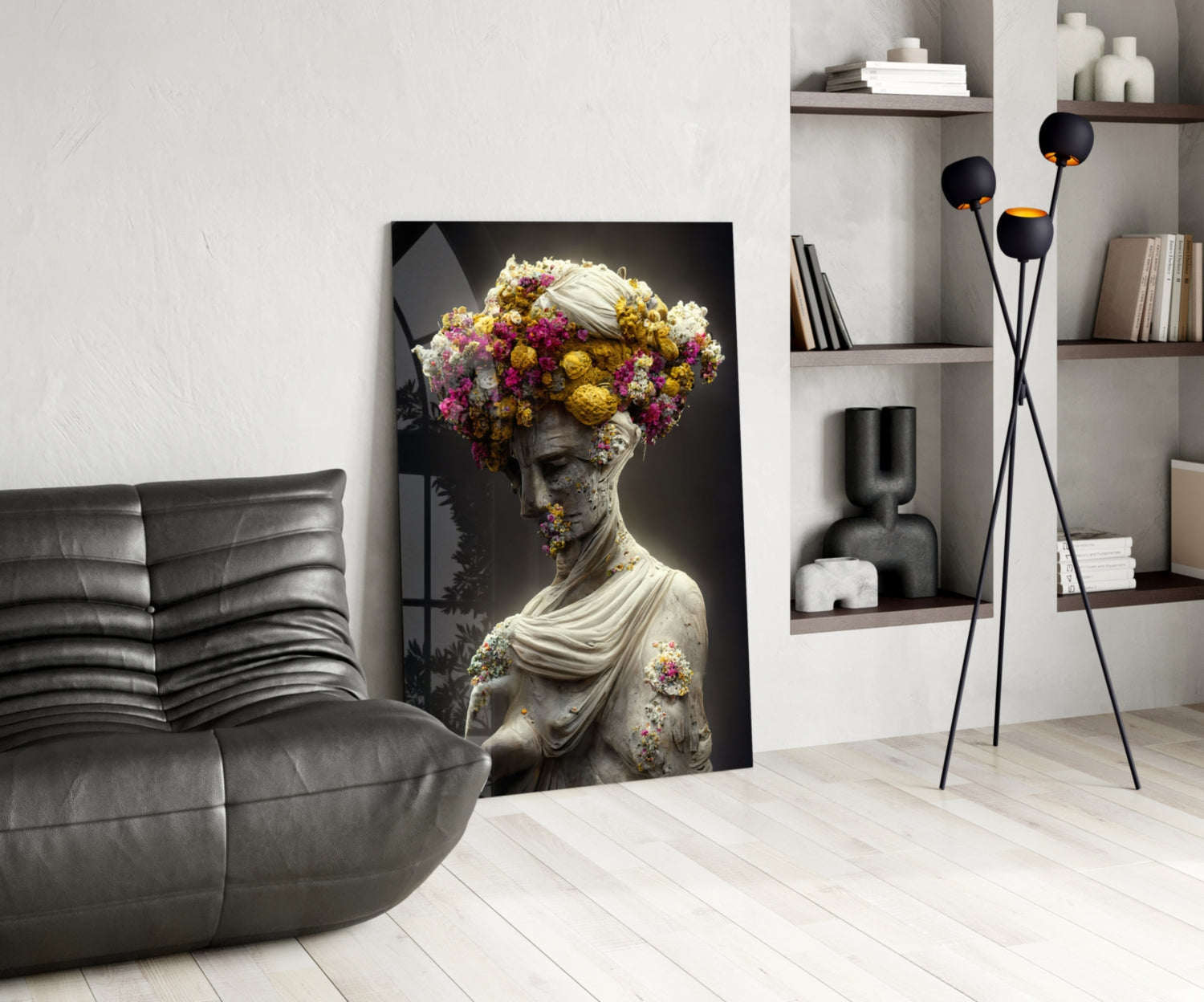 Classical stone bust with vibrant pink and yellow flowers adorning head and shoulders, displayed in modern living room setting.
