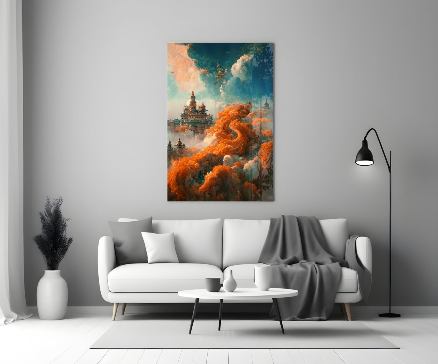 Dream Castle Glass Art mounted above white sofa in minimalist living room setting with orange clouds and architectural elements visible.