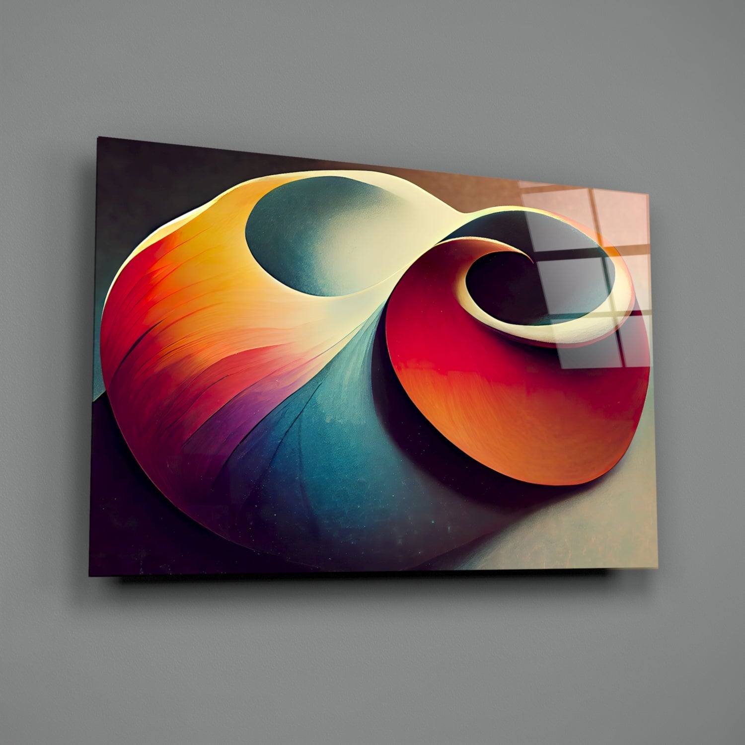 Abstract glass art piece featuring intertwined curved forms in red, orange, yellow, and teal with gradient shading and white outlines, displayed at an angle against gray background.