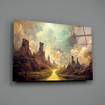 Glass art print displayed on gray wall showing a golden road through a fantasy canyon landscape with towering rock formations and luminous clouds.