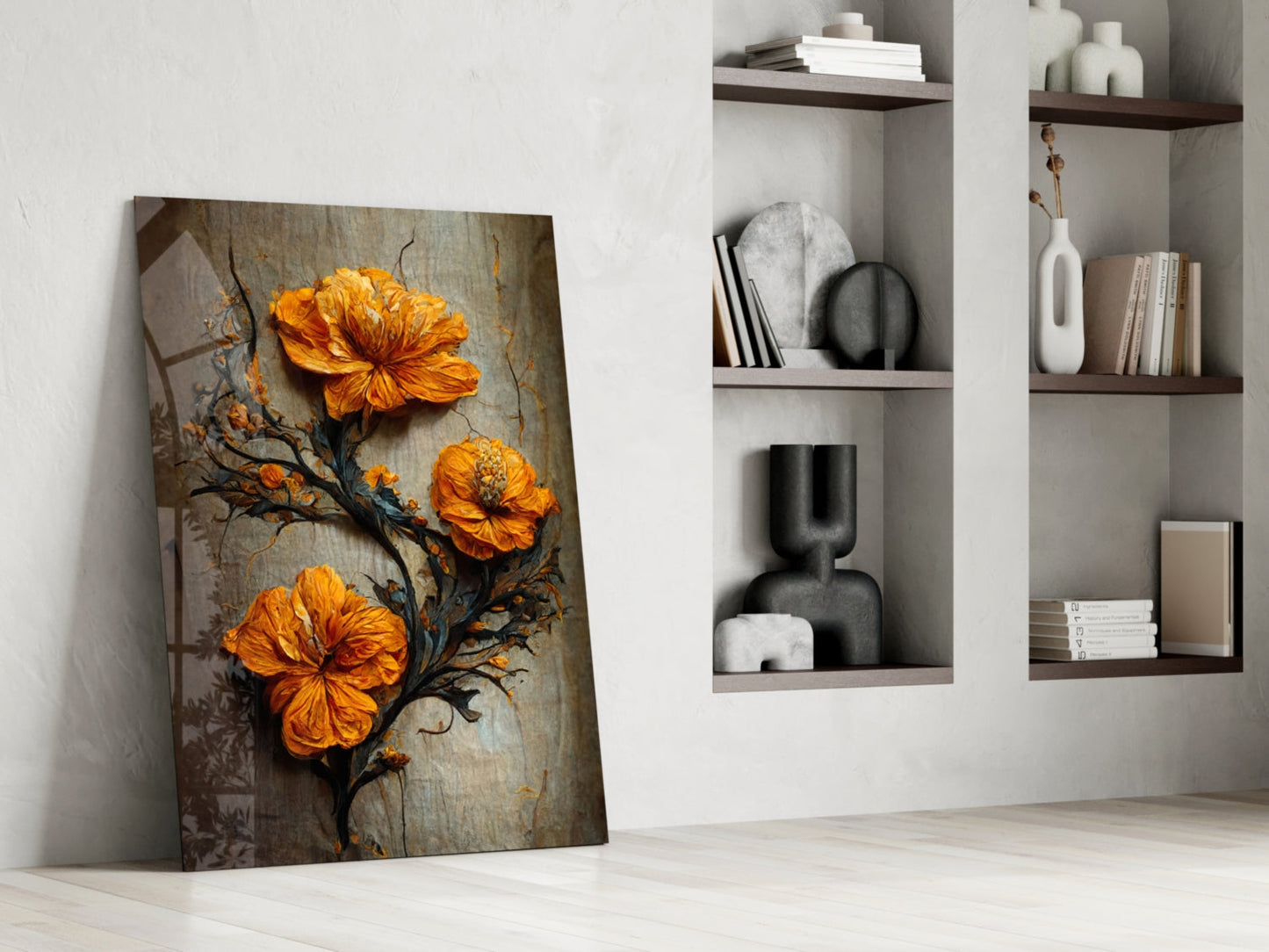 Glass art panel with three vibrant orange flowers on dark branch against weathered wood background, leaning against white wall beside shelving unit.