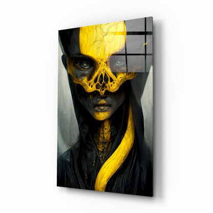 Angled product view of glass art panel featuring figure with dark face and golden skull mask design against black background.