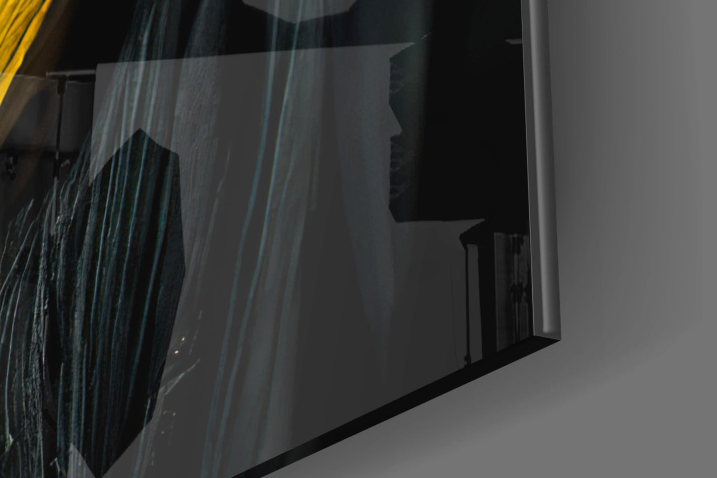 Close-up detail of textured glass art piece showing layered blue and grey striations with dark silhouette profile, angled view.