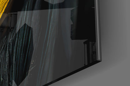 Close-up detail of textured glass art piece showing layered blue and grey striations with dark silhouette profile, angled view.