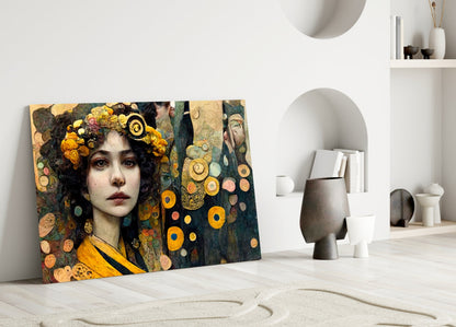 Glass art panel leaning against white wall displaying portrait of woman with golden floral crown and circular ornamental details in warm earth tones.