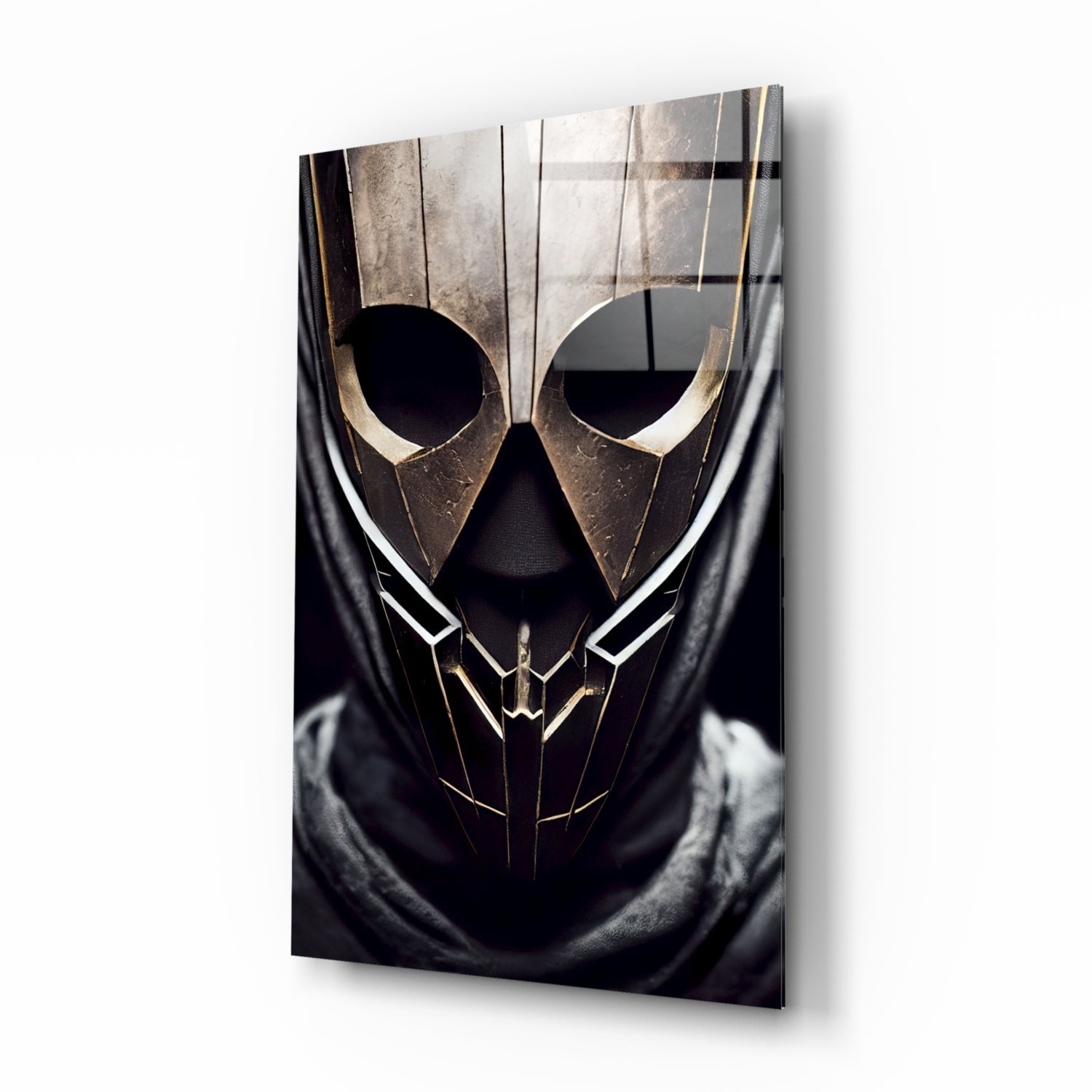 Gold and black metallic mask with angular features and large circular eye openings mounted on dark fabric, displayed as wall art.