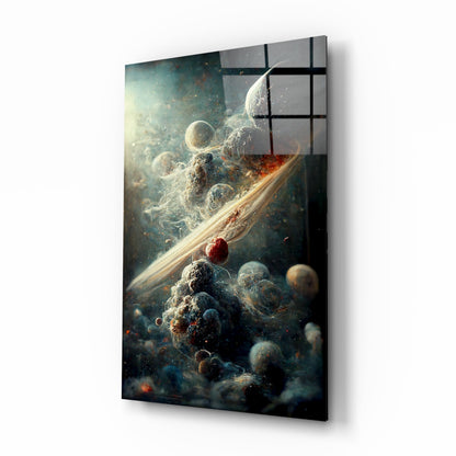Glass art panel displaying cosmic scene with swirling nebulae, planets, and golden ring against black gridded frame.