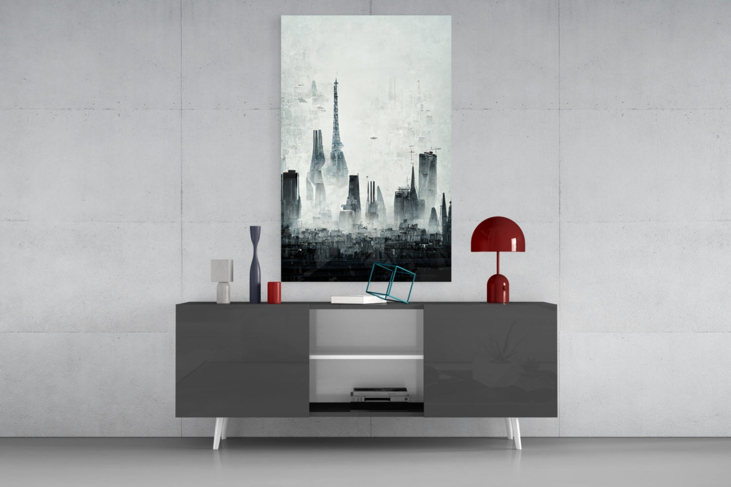 Monochromatic cityscape glass art print displayed above gray console table with white legs, styled with red lamp and decorative objects.