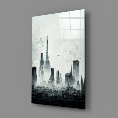 Angled perspective view of black and white cityscape glass art panel mounted on gray wall, showing tall buildings and skyline silhouette.