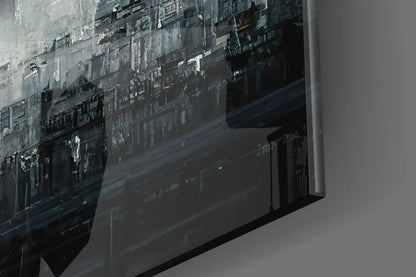 Close-up angled view of frosted glass art panel showing urban cityscape silhouette in grayscale tones.