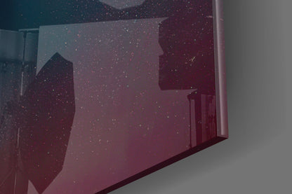 Angled view of glass art piece with deep burgundy and teal gradient, sparkle effect, and geometric faceted surfaces against neutral background.