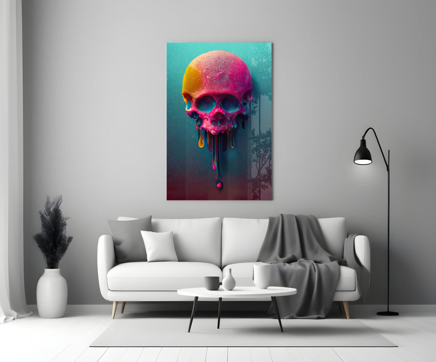 Colorful neon skull artwork with melting paint drips displayed above a white sofa in a modern living room.