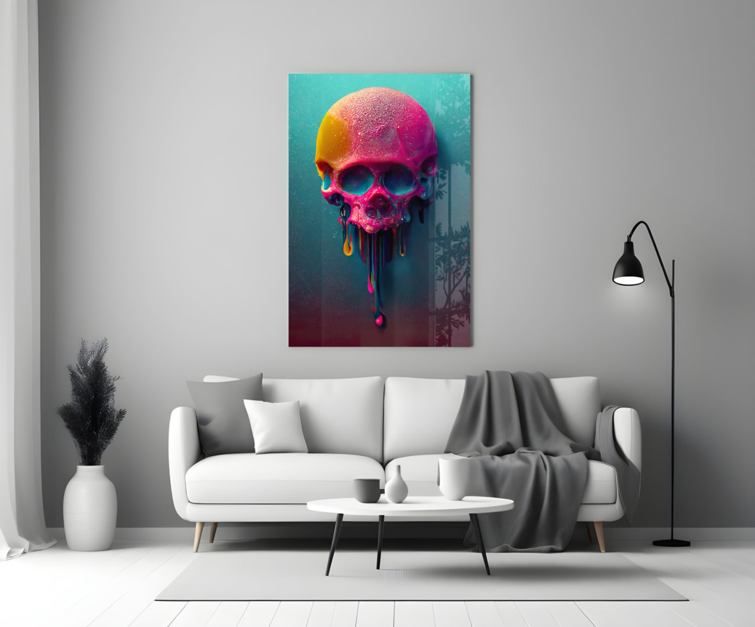 Colorful neon skull artwork with melting paint drips displayed above a white sofa in a modern living room.