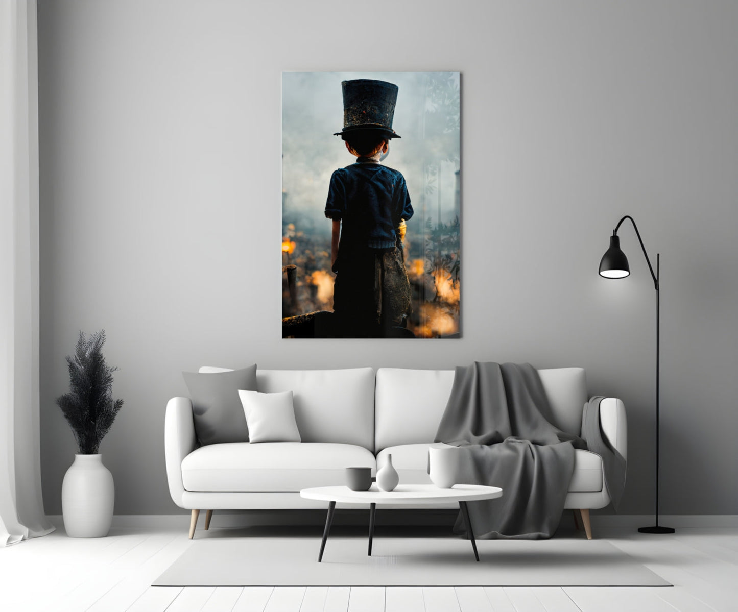 Child in dark blue shirt and tall black top hat viewed from behind, overlooking burning cityscape at golden hour.