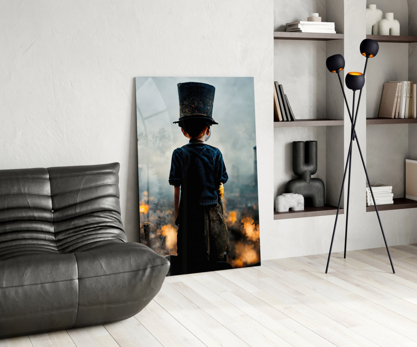 Glass art depicting a child in dark clothing and top hat standing amid orange flames, displayed in modern living room setting.