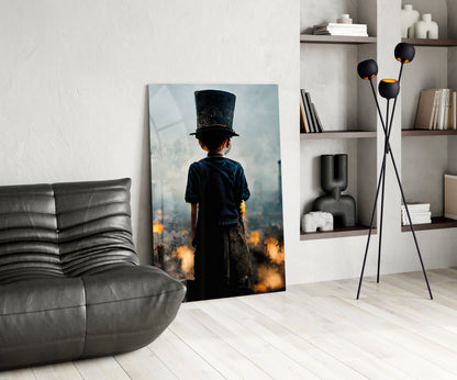 Glass art depicting a child in dark clothing and top hat standing amid orange flames, displayed in modern living room setting.